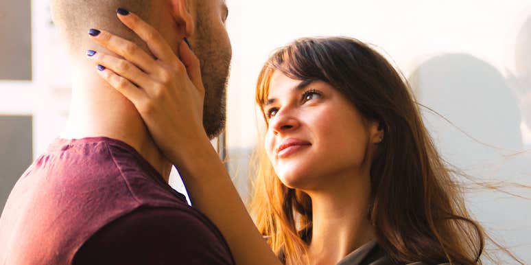 A close-up shot of a loving couple sharing a quiet, joyful glance, representing strong attachment, mutual respect, and compassionate partnership.