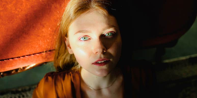 sad and lonely woman bathed in sunlight