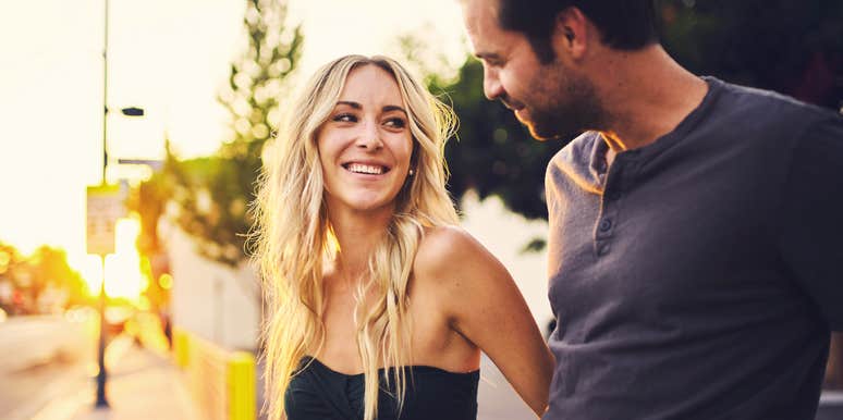 A close-up of a couple sharing an intimate, gaze-locked moment, representing 'affiliative bonding' and everyday linguistic validation in relationships.