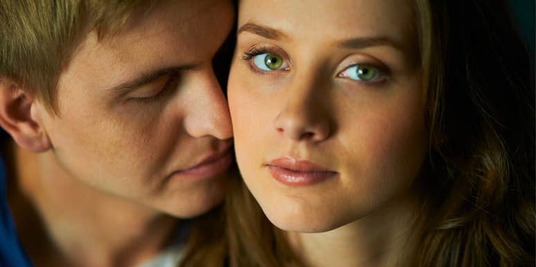 serious woman in a new relationship looking distant from man