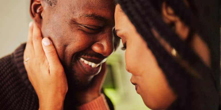 Foreheads together, his warm laugh and her gentle touch show the closeness peacemaking skills protect.