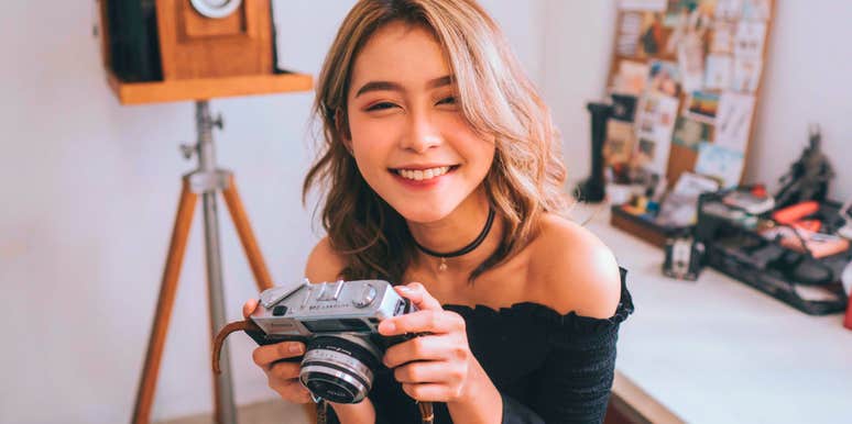 happy woman with photography hobby that brings her joy