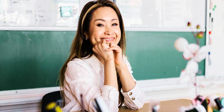 Smiling at her desk in front of the chalkboard, this teacher is easy to picture as someone worth getting to know.