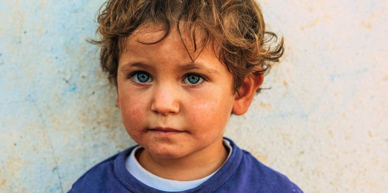 lonely little boy with bright eyes