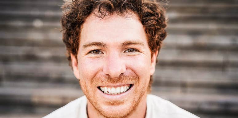 millennial man laughing at iconic phrases from his generation 