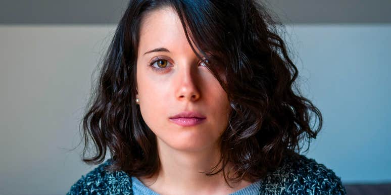 Serious brunette woman with thoughts going through her head 