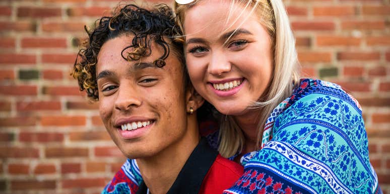 happy young couple hugging and smiling
