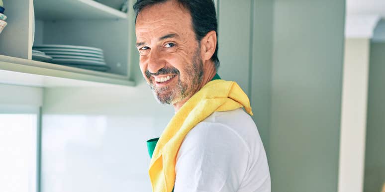 Gen X man cleaning in the kitchen 