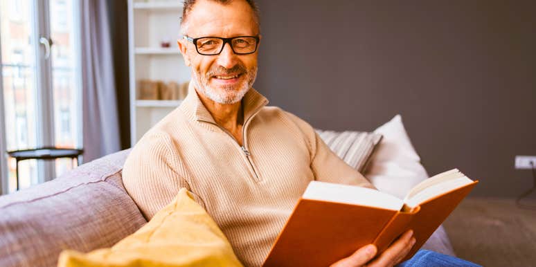 middle aged man in his 50s or 60s reading to stay sharp