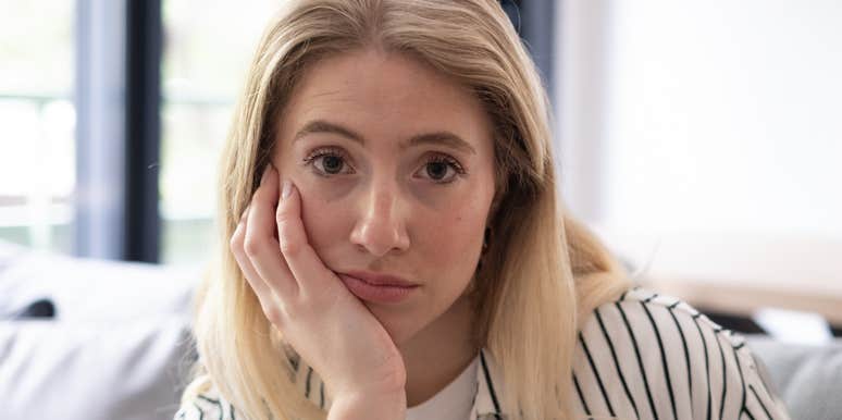 Woman zones out during conversation.