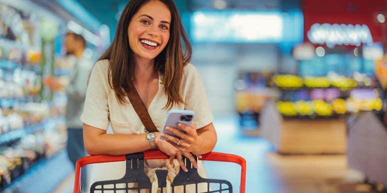intelligent woman doing a small shop at the grocery store