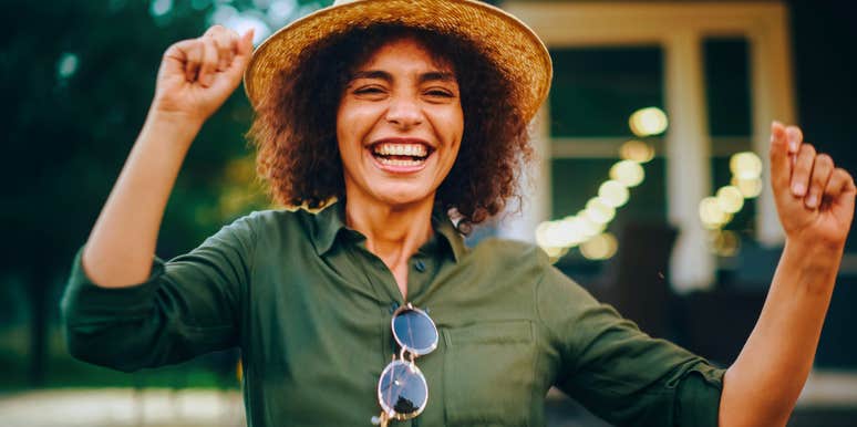 happy woman having fun dancing outside