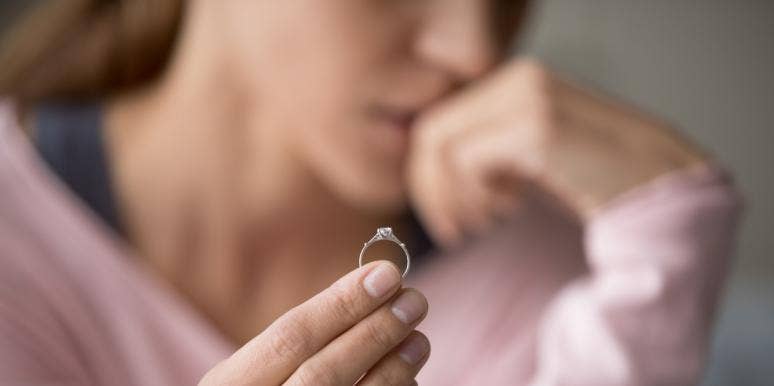 I Thought 22 Years and 9 Children Was Enough to Make Our Marriage Work — I Was Wrong woman holding wedding ring