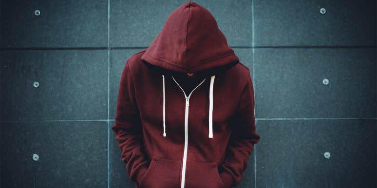 3 Parenting Tips To Make Sure You Don't Raise A Mean Bully teen boy in hoodie
