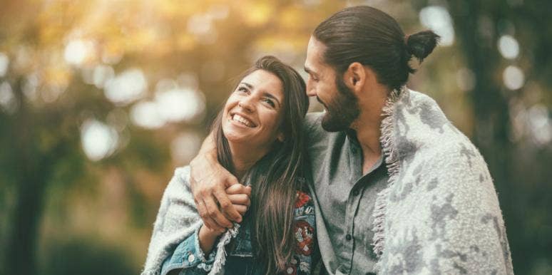 The 4 Major Differences Between Soulmates And Life Partners man and woman embracing in forest