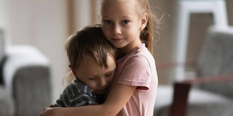 4 Critical Reasons I'm Shielding My Kids From 'Puppy Love' girl hugging boy