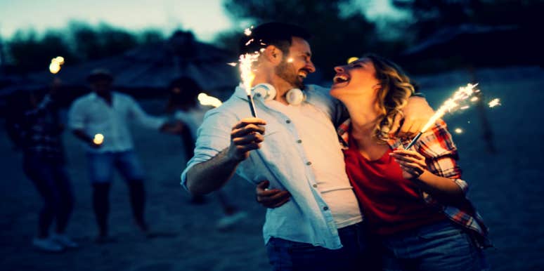 15 Romantic 4th Of July Date Ideas For Couples couple on a fun date with sparklers on the 4th of July