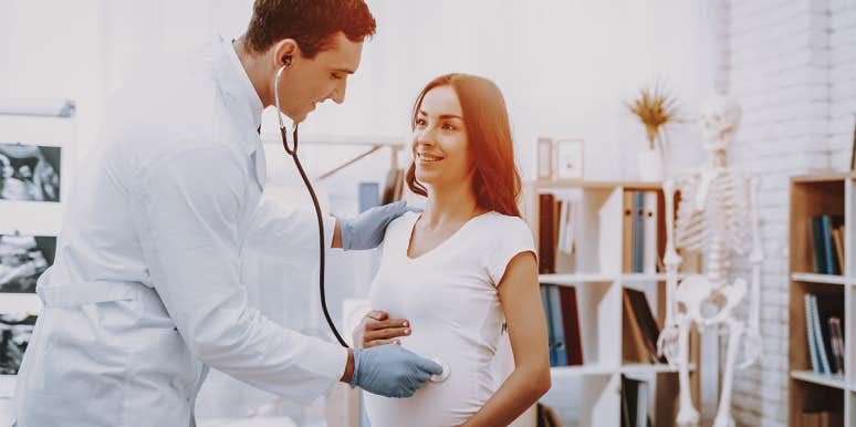 doctor checking on woman's pregnancy