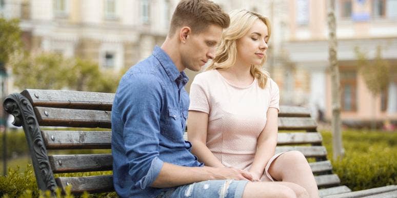 7 Uncomfortable Signs You're In An 'Almost' Relationship That Won't Work Out couple sitting on bench