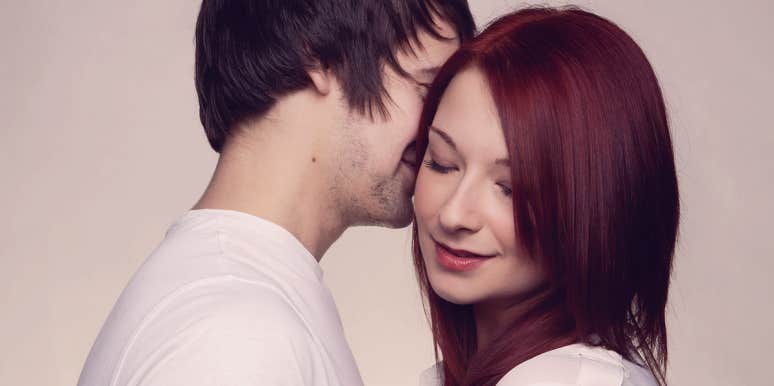 7 Phrases You Should Be Telling Her Other Than 'I Love You' man whispering by the woman