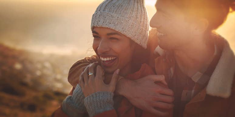7 Unsexy Ways To Have An Instantly Happier Relationship man hugging woman from the back