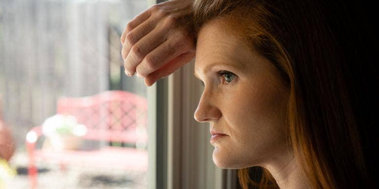 When Death Occurs Before Birth: Coping With The Stillbirth Of My 34-Week-Old Baby woman looking out window