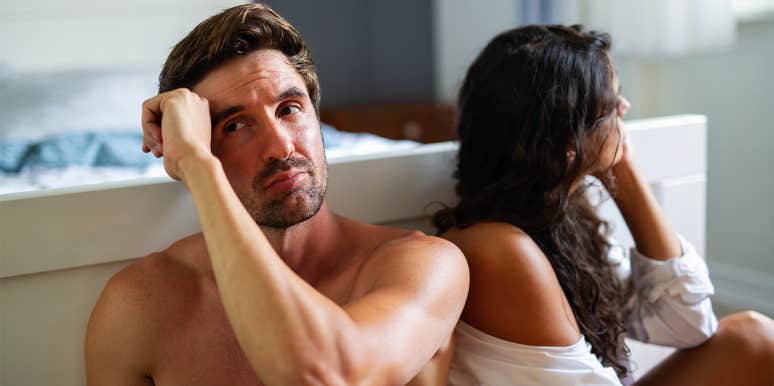 9 Signs Your Relationship Isn't Just Failing — It's Already Over unhappy couple in bedroom