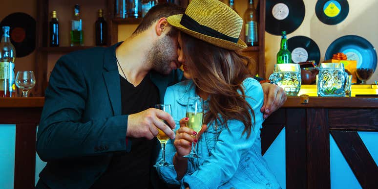 man flirting with woman at bar