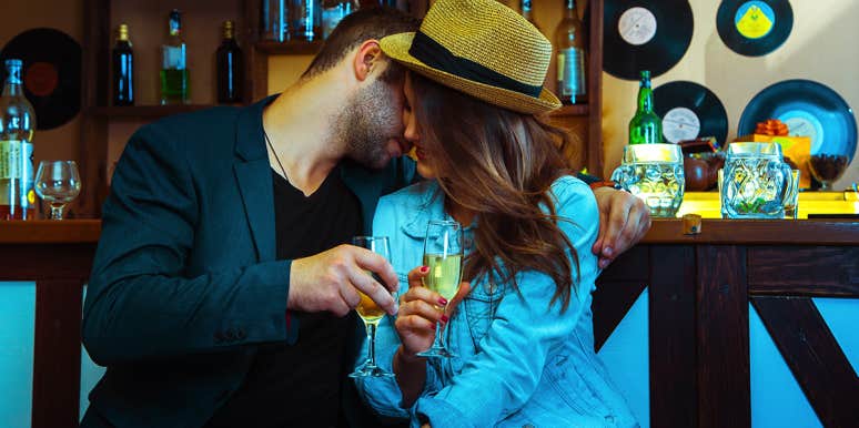 9 Ways To Tell If He's Only Interested In Hooking Up man flirting with woman at bar