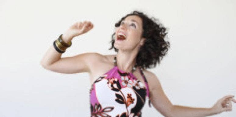 7 Things You Must Do Before A First Date woman dancing before a first date