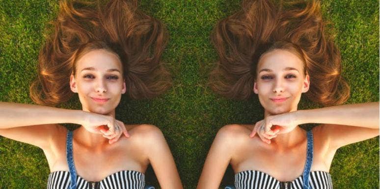 The Idealist - INFP Personality Traits & Characteristics woman with striped shirt laying in grass smiling