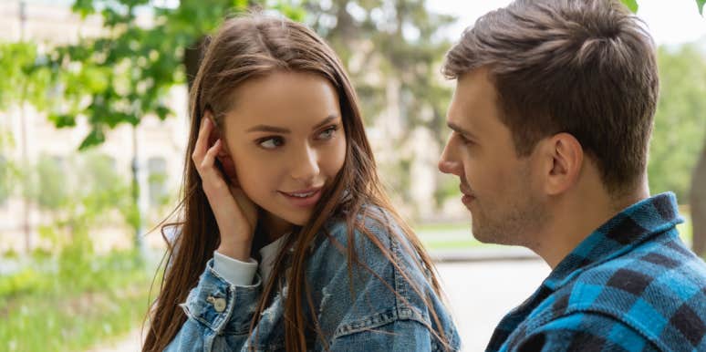 How Do You Know if She Wants You To Make A Move? couple flirting fixing hair