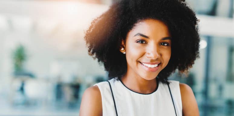 How to stop wasting time Black woman smiling at work`