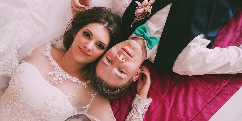 Why Making Men Stay Abstinent Until Marriage Makes Sex Worse couple wedding laying down