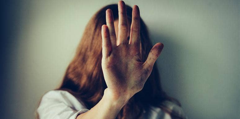 I Remarried My Abusive Ex-Husband... And Then Divorced Him Again woman putting her hand to the camera