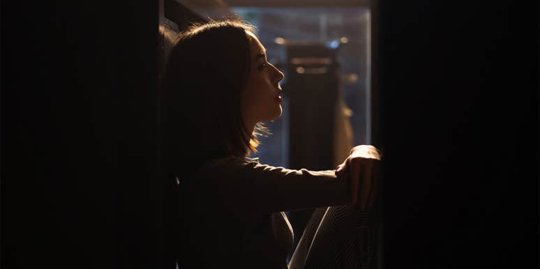 Why Broken Women Are The Strongest Women woman sitting in the dark