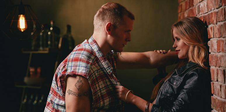 How Almost Having An Affair Saved My Marriage couple leaning against a wall