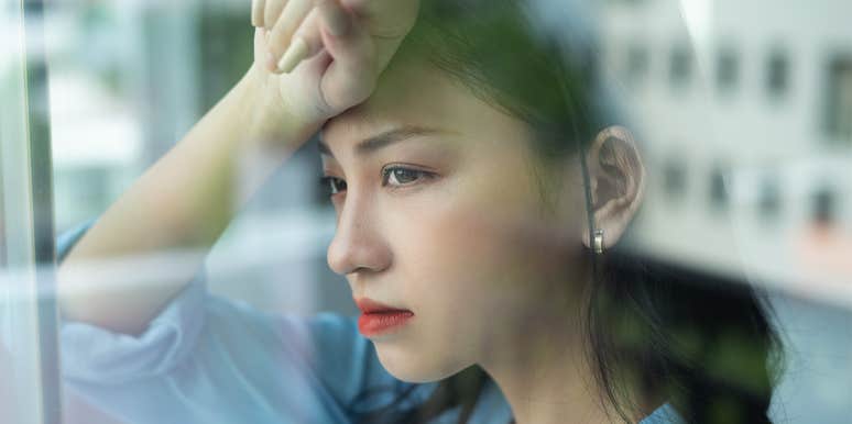 I Always Saw Myself As White Until I Encountered Racism asian woman looking out window
