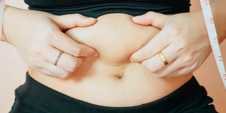 I’m Anorexic — But I’m Also Fat woman grabbing belly fat