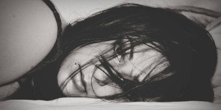 anxiety relief black and white photo of woman lying down