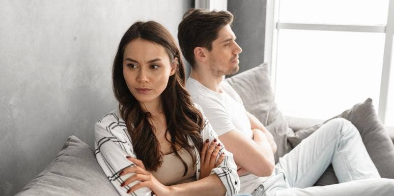 Woman Calls Out Boyfriend's Weight After He Makes A Rude Comment About Girls couple arguing and not speaking on couch