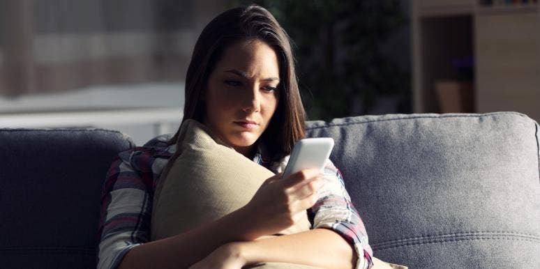 arguing on the internet woman looking at her smartphone