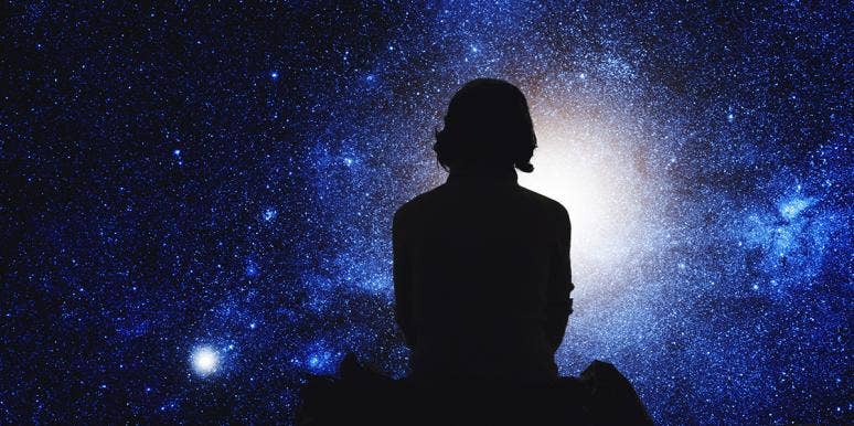 How Astrology Cured My Panic Attacks woman sitting watching stars