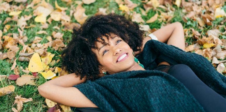 autumn season woman lying on leaves