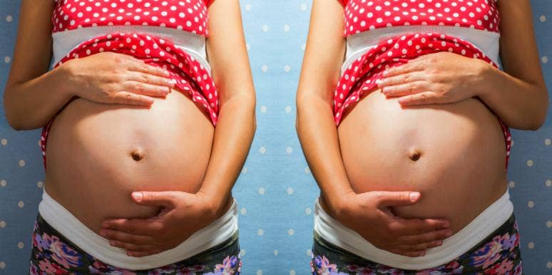 woman holding pregnant belly