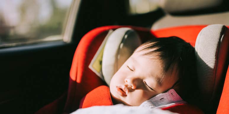 Baby sleeping in car seat in car