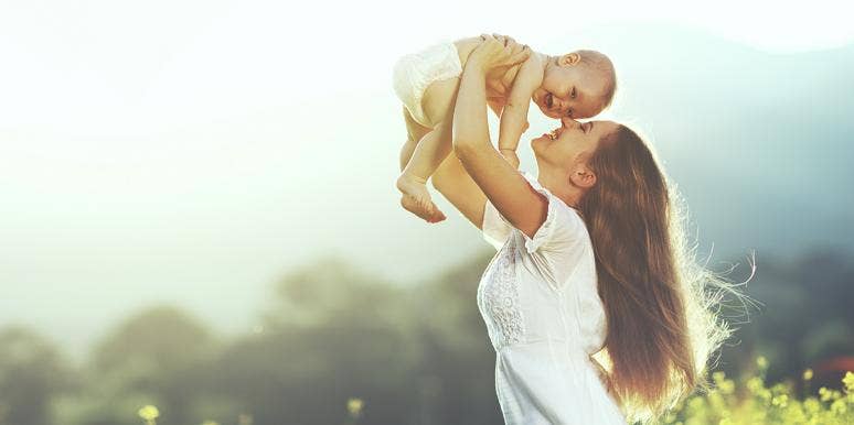 Find Out What Your Name Would Be If You Were Born Today woman kissing baby