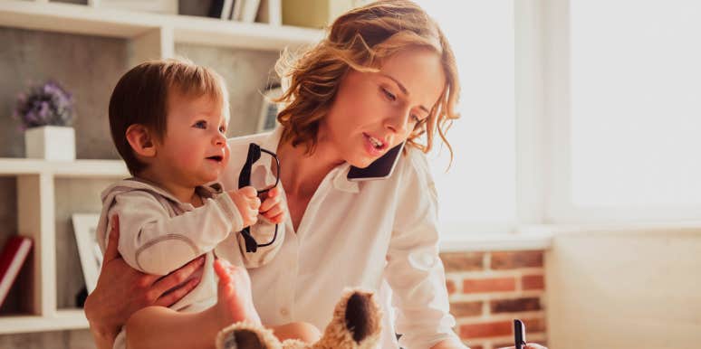 Babysitter Calls Cops On Mom Who Didn't Pick Up Her Son Woman on the phone while holding baby