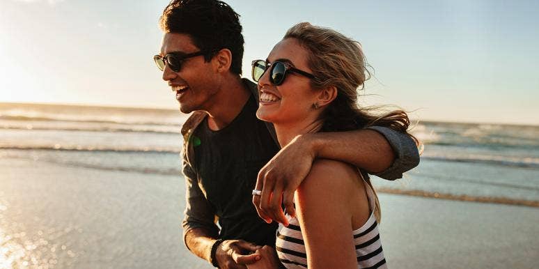 10 Things Every Rational Couple Should Do Before They Have Kids man and woman on beach