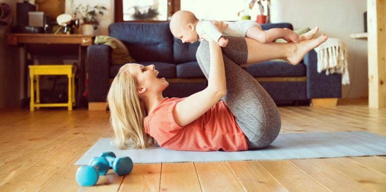 woman working out at home with baby woman working out at home with baby